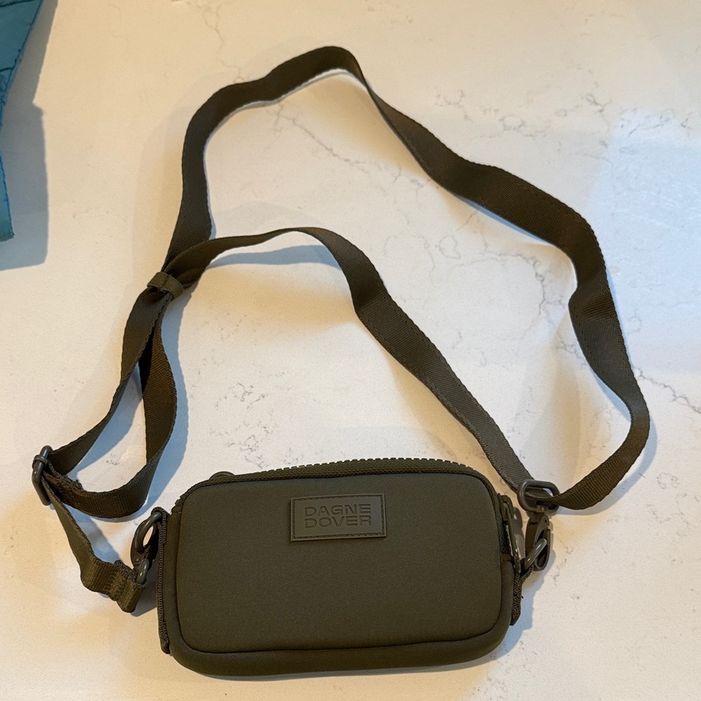 Dagne Dover Olive Green Mara Phone Sling Bag comes with drawstring pouch